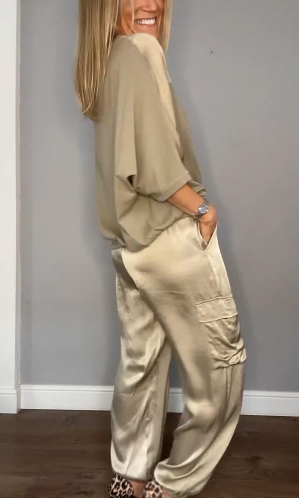 Model wearing the MIA Women's ladies suit, showcasing its elegant drape and fit.