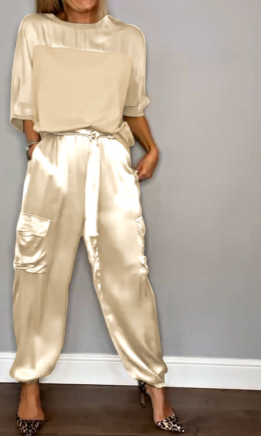 Front view of the MIA Women's two-piece satin set, emphasizing its modern silhouette.