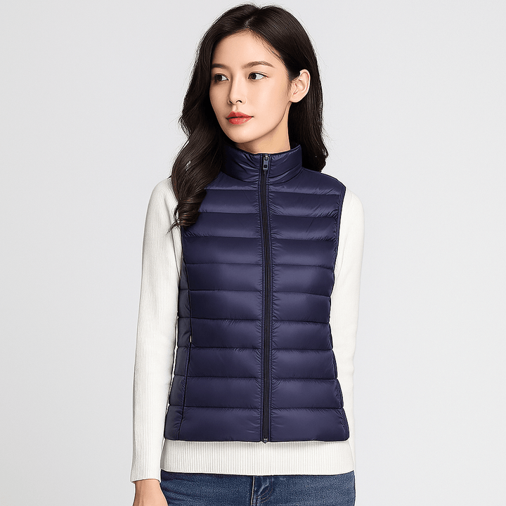 Stylish women's lightweight puffer jacket with pleated detailing. Warm winter coat for elegant everyday wear.