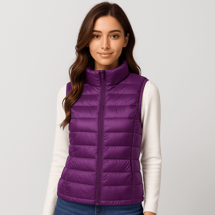 Elegant women's lightweight puffer jacket with a stylish pleated design. Warm and cozy for winter.