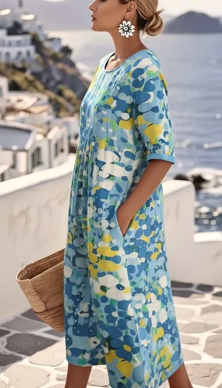 Elegant A-line women's midi dress featuring a vibrant abstract floral print, short sleeves, ideal for occasions.