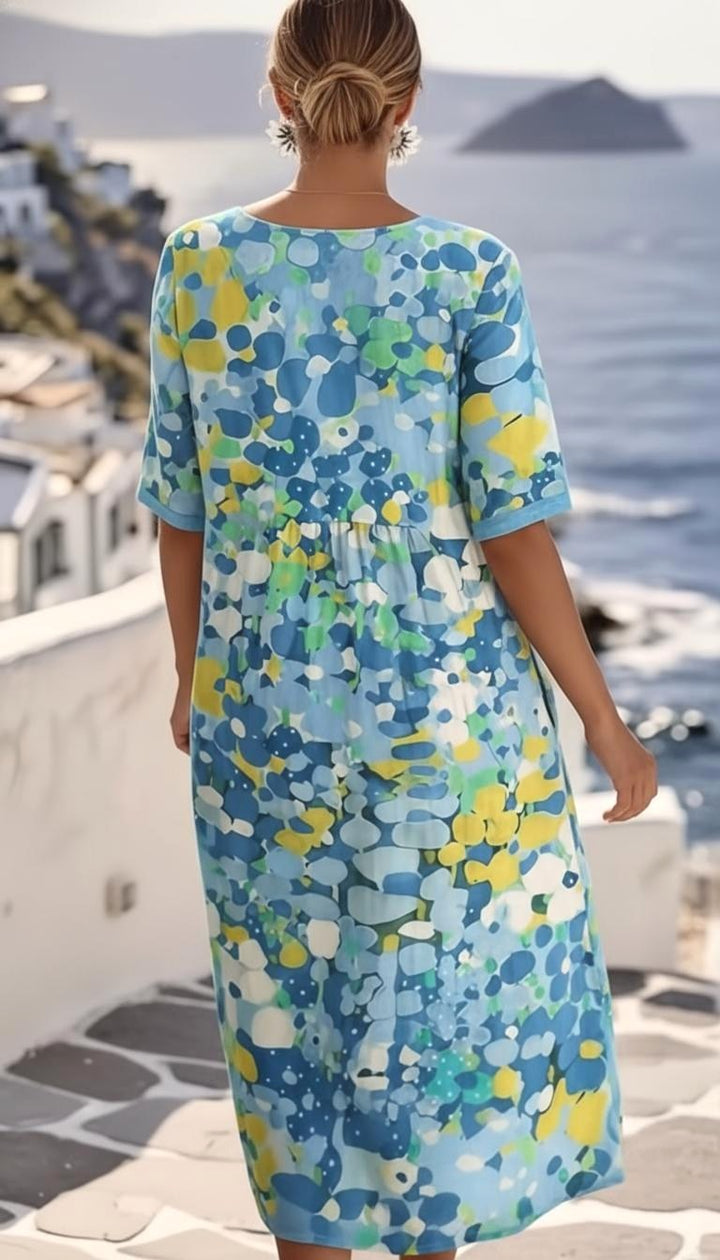 Stylish women's abstract floral blue midi dress, short sleeve A-line cut, an elegant choice for events.