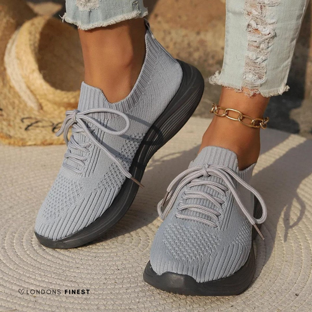 Close-up of women's breathable orthopedic walking trainers, showcasing cushioned sole, arch support, and comfortable fit.