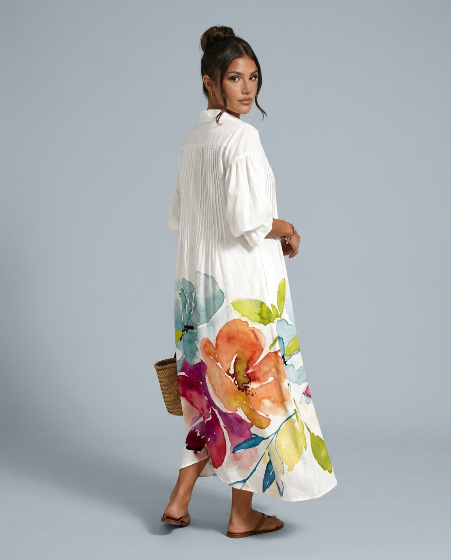 Casual women's orange floral print maxi dress featuring a relaxed fit, button front, and elegant balloon sleeves.
