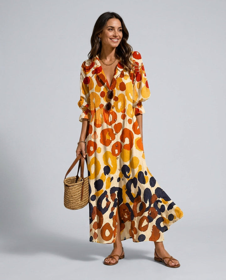 Women's relaxed fit orange maxi dress with a vibrant floral print, flowing silhouette, and casual summer style.