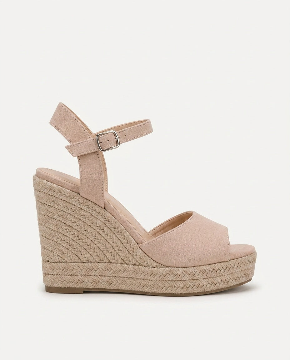 Stylish women's espadrille wedge sandals with elegant braided ankle strap. Ideal summer footwear choice.