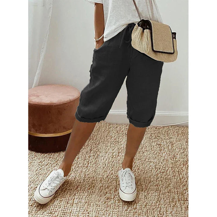 Chic women's cropped pants with a flattering drawstring waist, ideal for warm weather, casual outings, and comfy fashion.