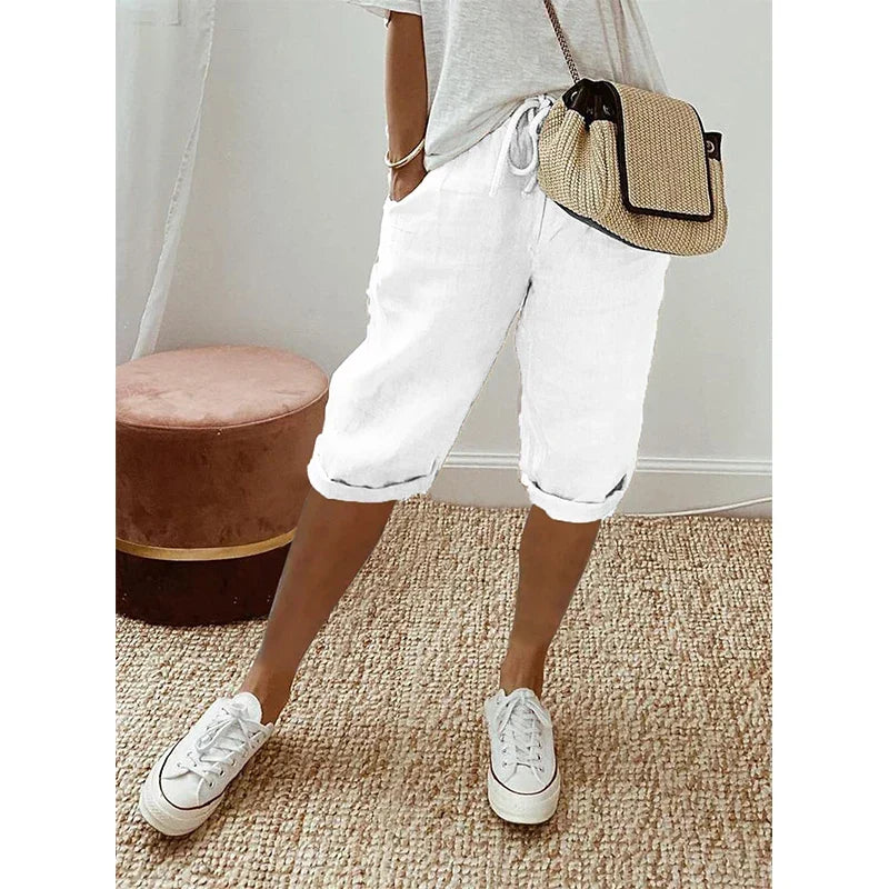 Women's fashionable cropped pants, relaxed cut with adjustable drawstring waist, great for summer style & versatile looks.