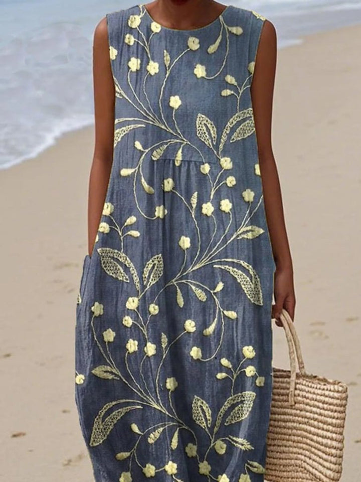 Stylish women's floral midi dress, sleeveless and perfect for spring vacations or everyday casual wear. Flowy comfortable fit.
