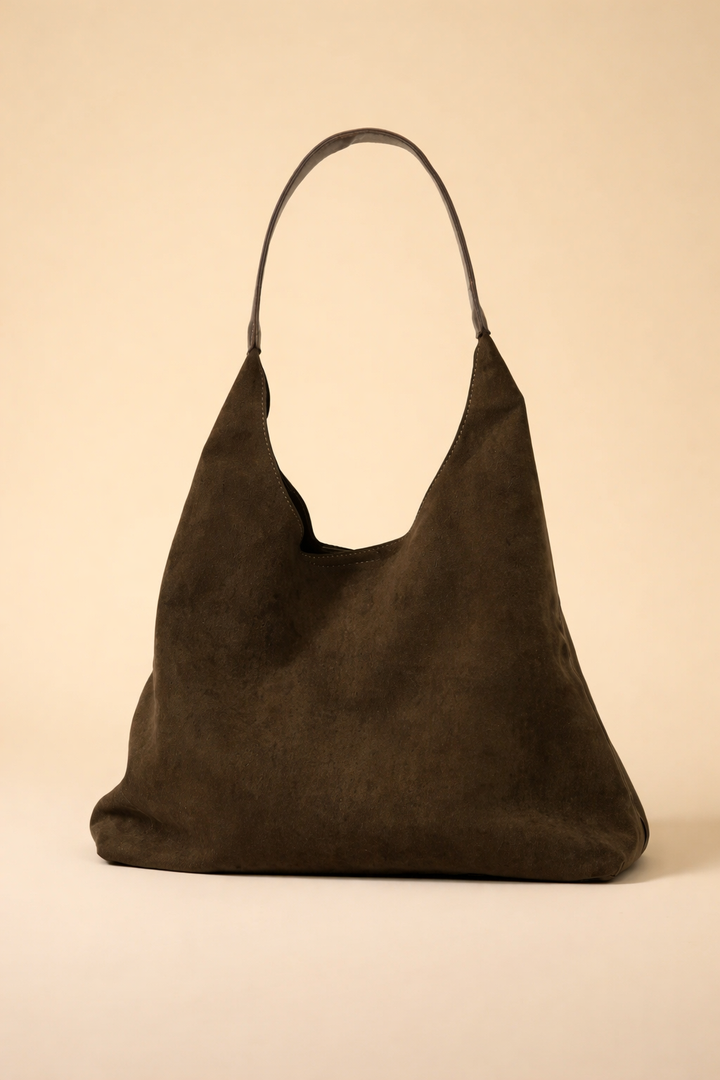 Smooth suede minimalist hobo bag. Stylish women's shoulder bag, a chic casual accessory.