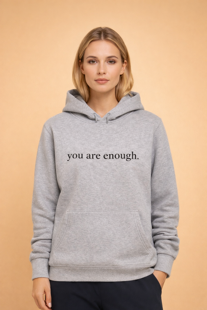 Trendy women's oversized slogan hoodie. A comfortable pullover hooded sweatshirt for casual wear and style.