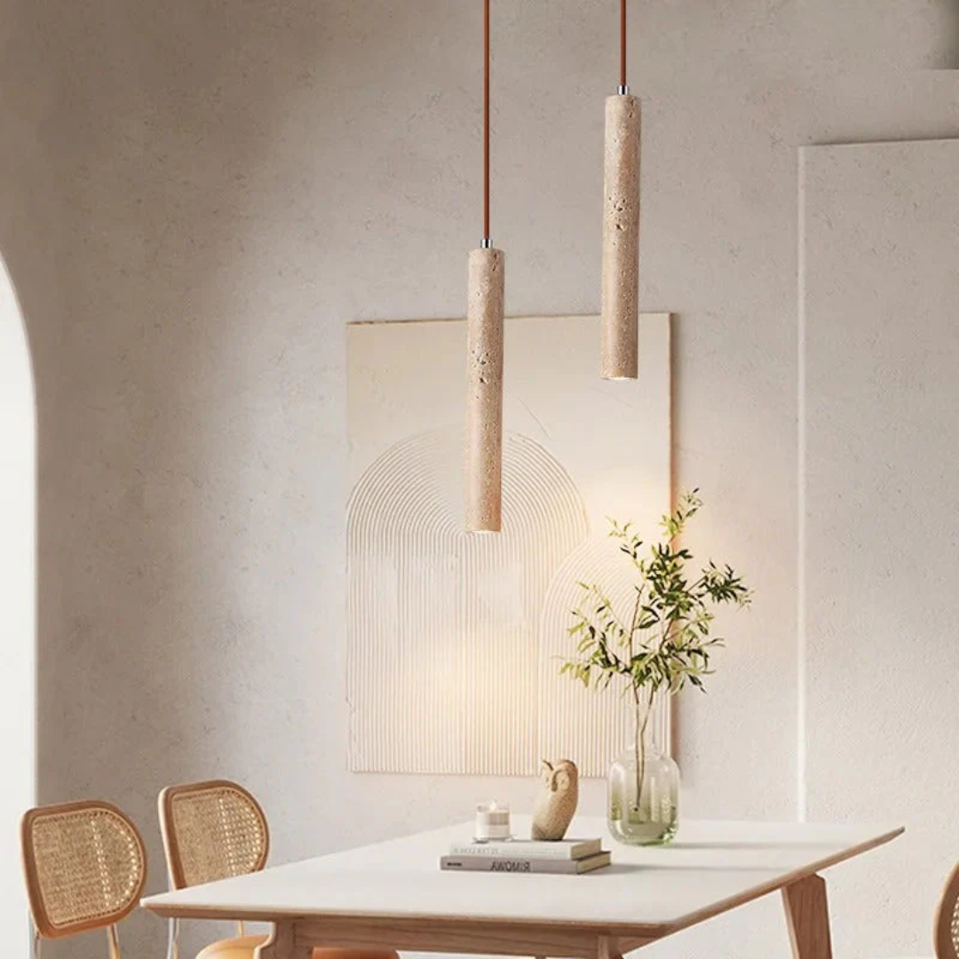 Close-up of LumoLine minimalist chandelier showcasing textured travertine and warm LED.