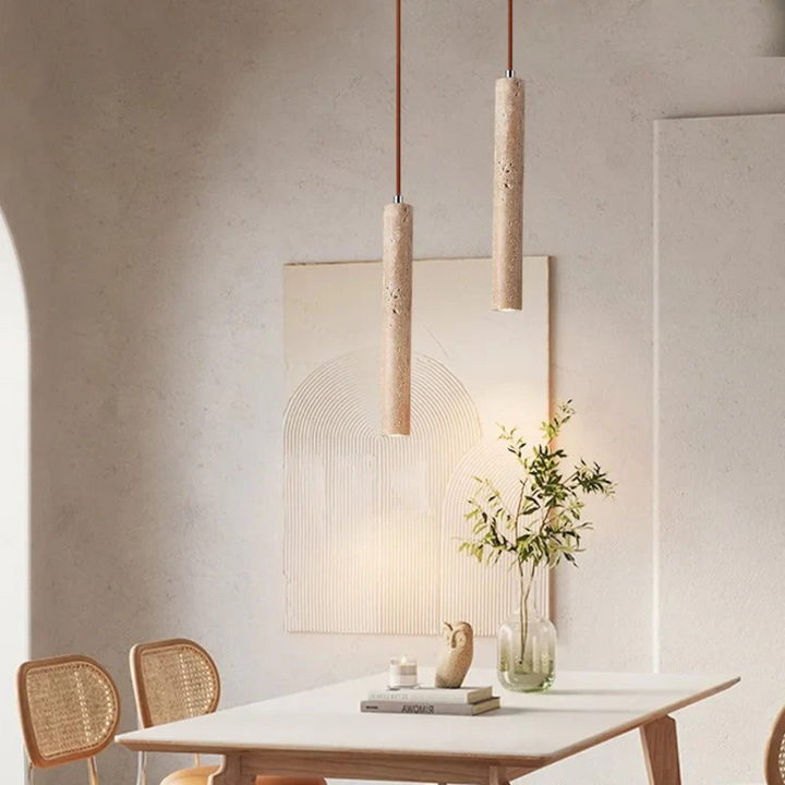 Close-up of LumoLine minimalist chandelier showcasing textured travertine and warm LED.