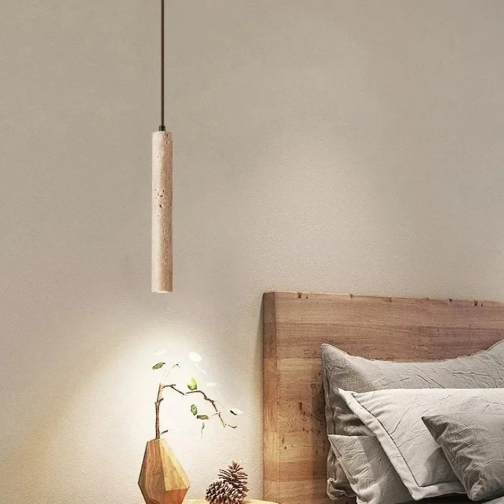 Designer travertine lamp, LumoLine LED chandelier providing a warm, inviting glow.