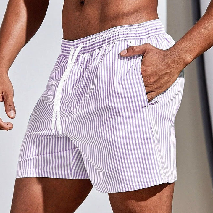 Comfortable men's striped drawstring swim shorts. Relaxed fit beachwear, perfect for summer vacation fun.