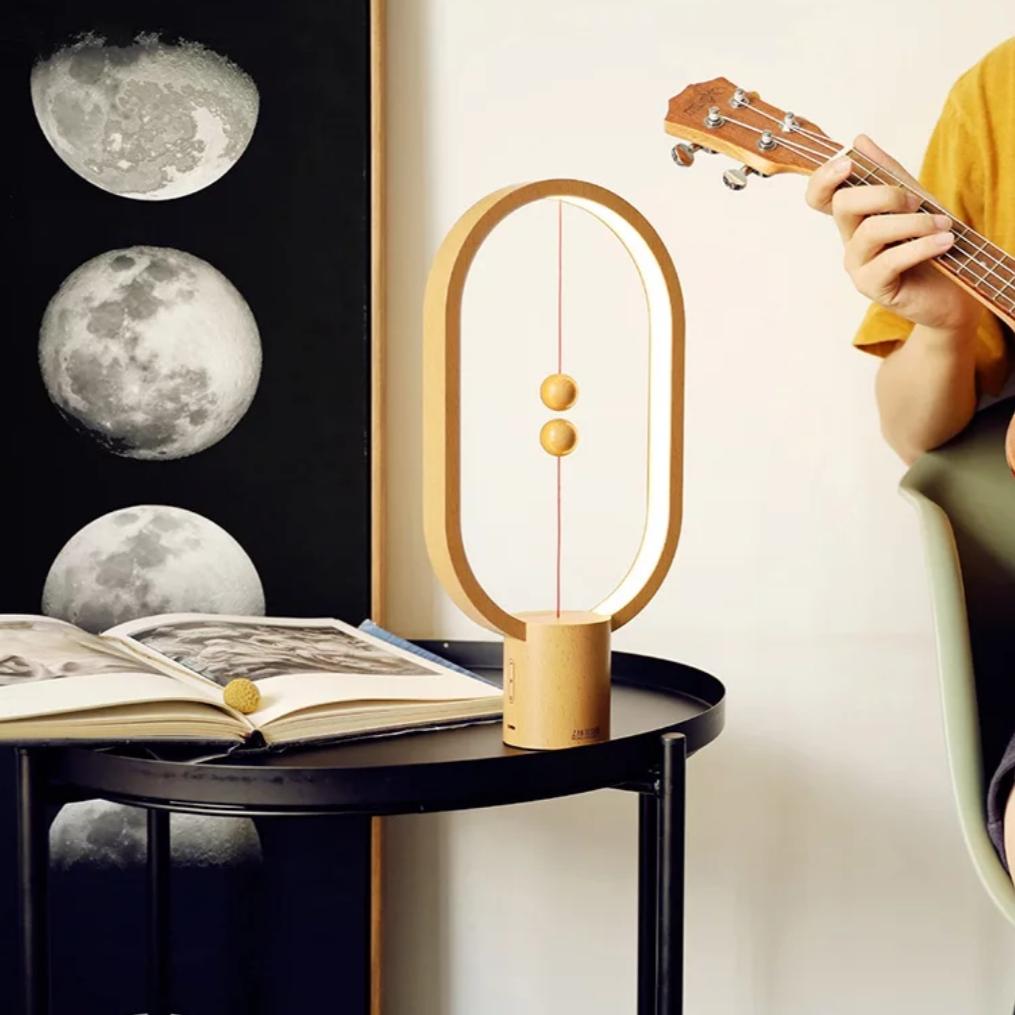 Contemporary balance LED table lamp, a unique home decor piece with an elegant floating switch design.