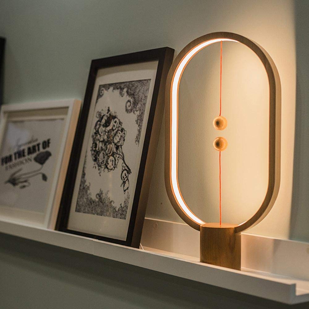 Stylish LED balance lamp, a modern desk accessory with an innovative floating on/off switch.