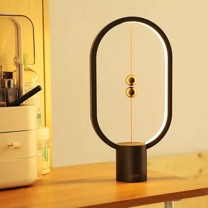Innovative balance table lamp for modern homes, features a unique floating switch and ambient LED light.