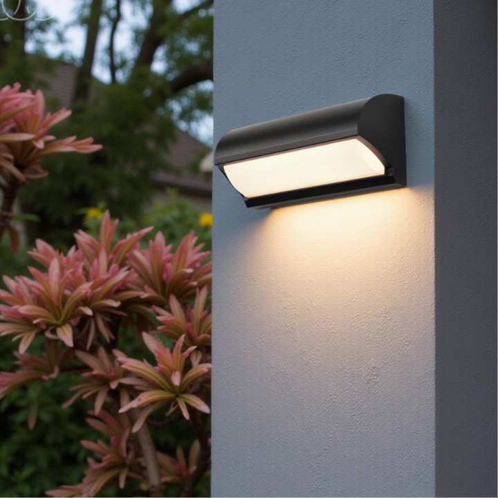 Modern black outdoor LED wall light for garden & patio. Weatherproof, energy-efficient exterior illumination.