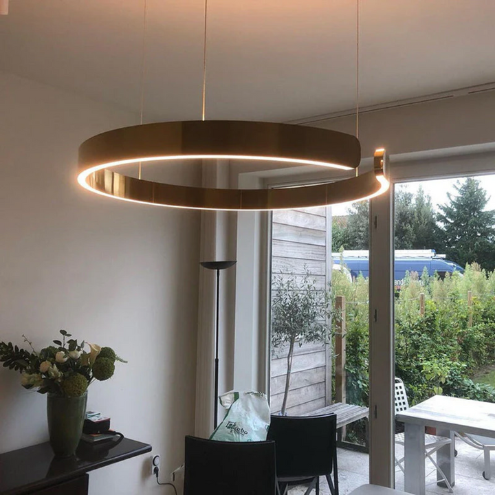 Modern dimmable LED circle pendant light, elegant ceiling fixture for living room or dining area.