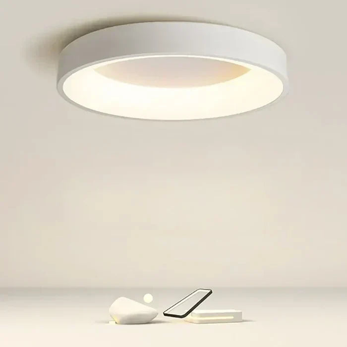 Sleek modern circular LED ceiling light for stylish home decor, offering minimalist design and energy-efficient lighting.