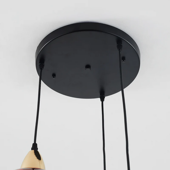 Statement 3-lamp cluster pendant, modern lighting fixture for stylish interior design.