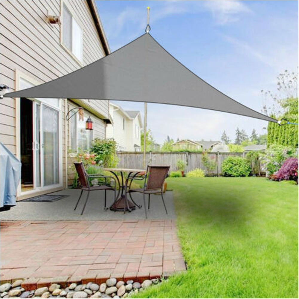Modern outdoor shade sail cover for patio. Provides weather resistant sun and UV protection.