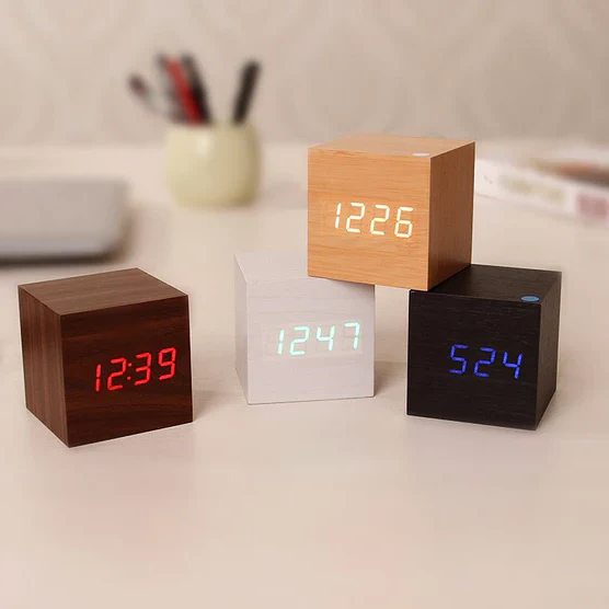 Modern digital wood clock with LED time display, perfect minimalist tabletop desk clock for home or office decor.