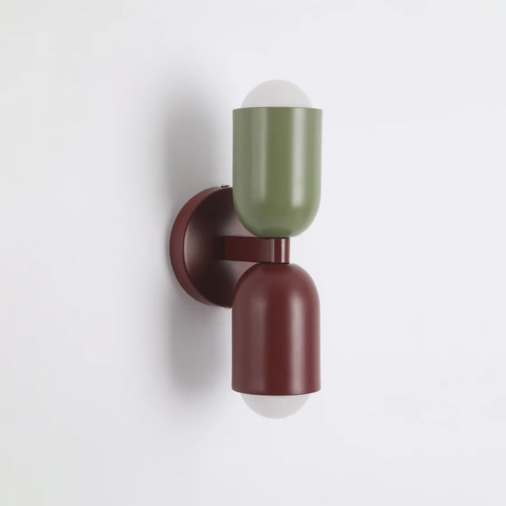 Design LED wall lamp, wall-mounted, providing vibrant double-sided ambient light for modern interiors.