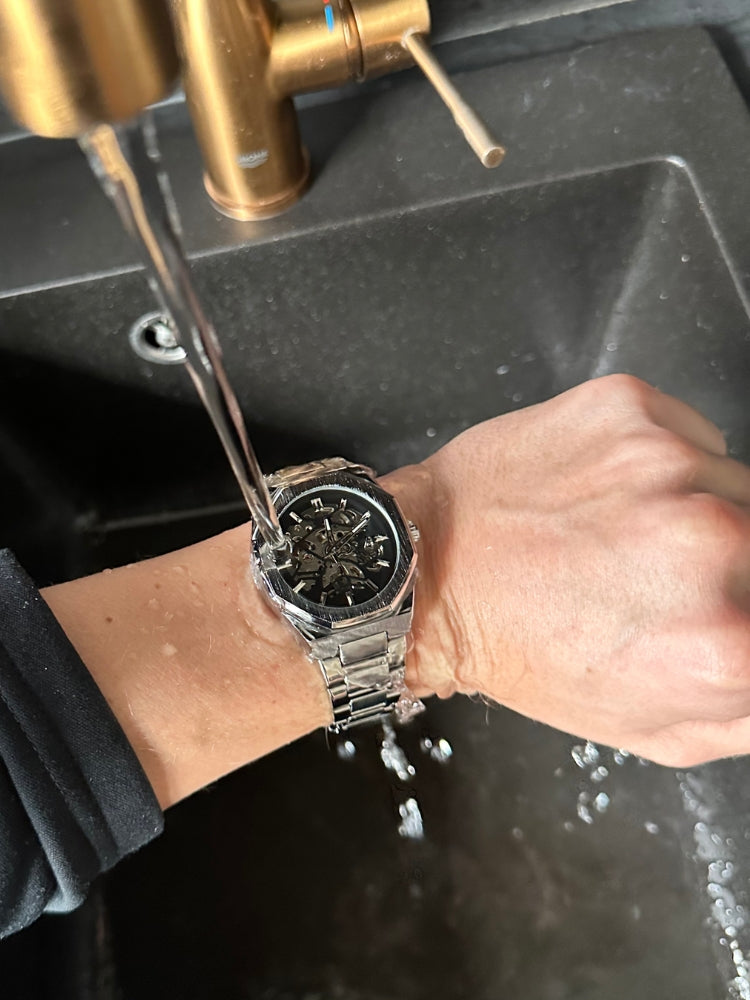 Men's modern automatic watch with a captivating skeleton dial, highlighting its intricate mechanical movement.