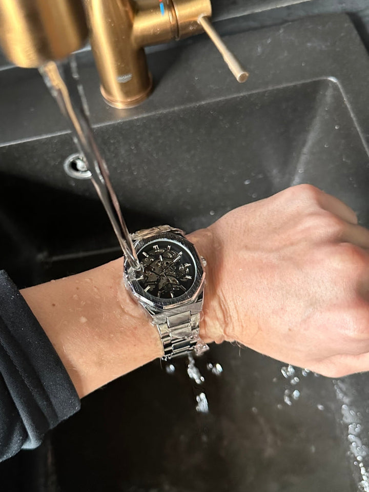 Men's modern automatic watch with a captivating skeleton dial, highlighting its intricate mechanical movement.