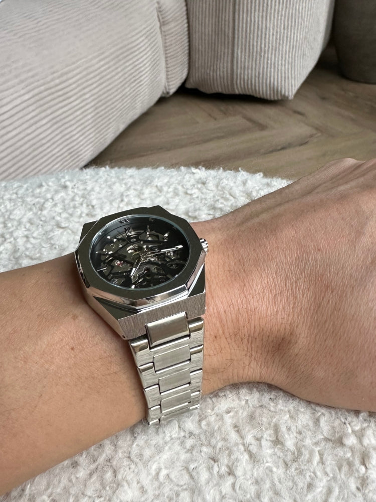 Men's luxury automatic skeleton wrist watch, modern, elegant, and durable with a unique open-heart dial.
