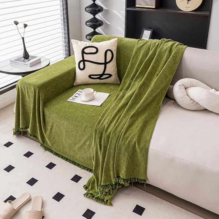 Beige modern sofa throw blanket draped over a couch, offering both stylish living room decor and pet protection.