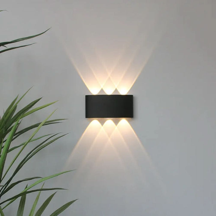 Energy-efficient LED wall light with a clean, modern minimalist design for any indoor/outdoor space.