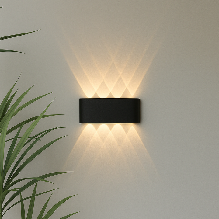 Weather-resistant contemporary LED wall light, provides stylish and functional outdoor illumination.