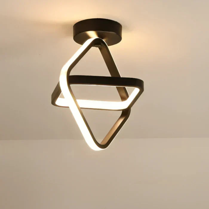 Sleek double ring LED ceiling fixture. Modern lighting for an elegant and energy-efficient home.
