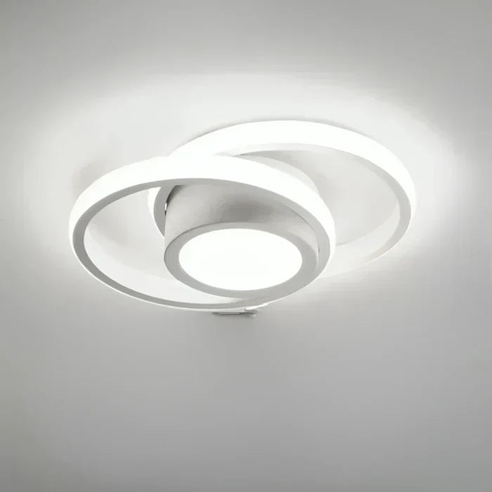 Warm white LED double ring ceiling lamp. Modern lighting for cozy, energy-efficient home decor.