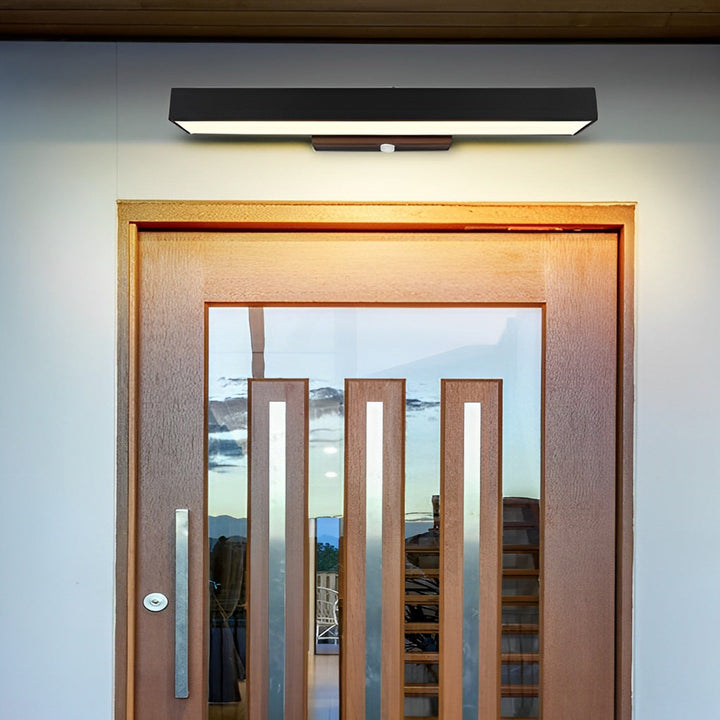 Outdoor black LED wall light with motion sensor, perfect for pathways, patios, and home security.