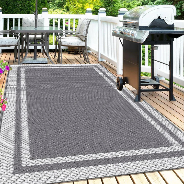 Modern gray rectangular patio mat with geometric design, reversible & water-resistant for outdoor living.