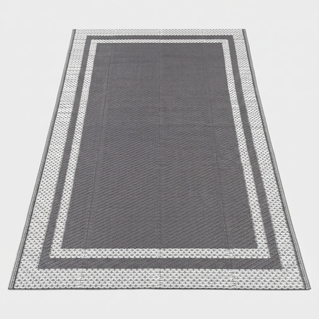 Durable rectangular outdoor patio mat, water-resistant, modern geometric gray design for deck decor.