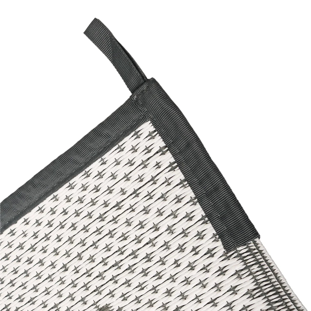 Water-resistant outdoor rectangular mat, modern geometric gray design, ideal patio or deck rug.