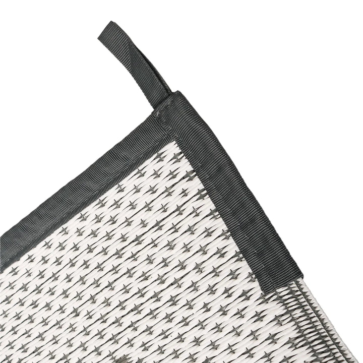 Water-resistant outdoor rectangular mat, modern geometric gray design, ideal patio or deck rug.