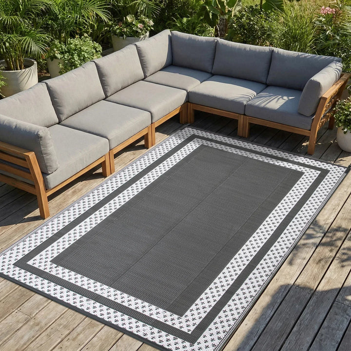 Gray modern outdoor patio rug, rectangular with geometric pattern, reversible & portable for camping.