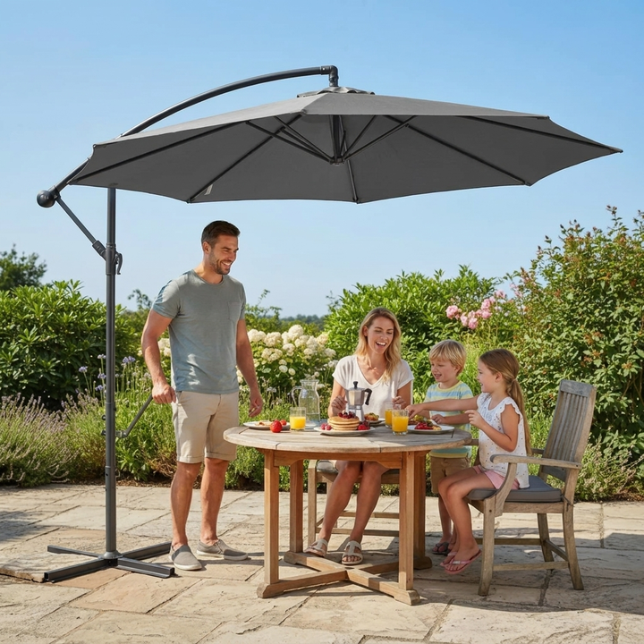 Black outdoor patio sun shade parasol with easy crank system providing ample shade for relaxation.