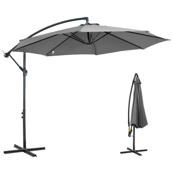 Large black outdoor patio umbrella with easy crank system, providing cool shade for garden relaxation.