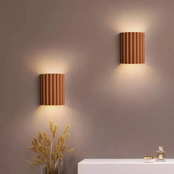 Artistic wave design resin wall lamp. Modern LED accent lighting for stylish interior decor.
