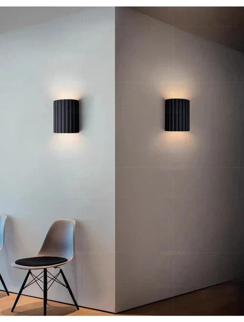 Energy-efficient LED resin wall lamp. Modern artistic wave design adds contemporary style to any room.