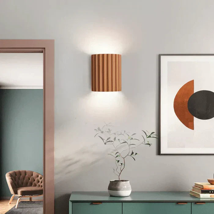 Decorative LED wall lamp, offering warm or cool white light. Modern artistic wave resin design.