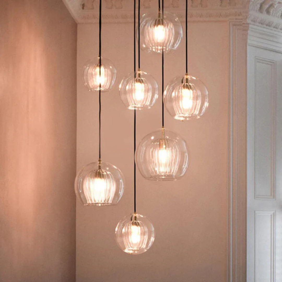 Adjustable modern LED pendant, Aurora Sphere, a striking focal point for any room.