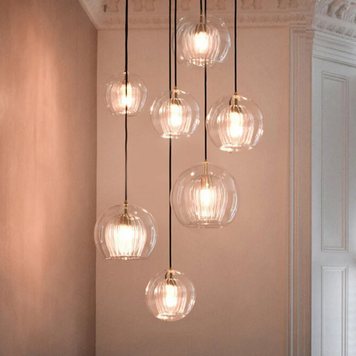 Adjustable modern LED pendant, Aurora Sphere, a striking focal point for any room.